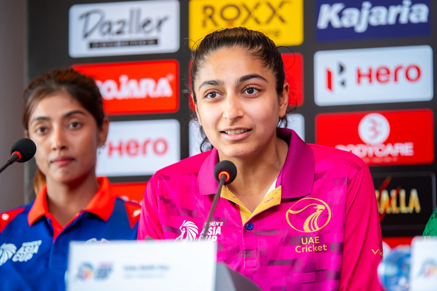 Esha Oza addresses the media as Indu Barma looks on