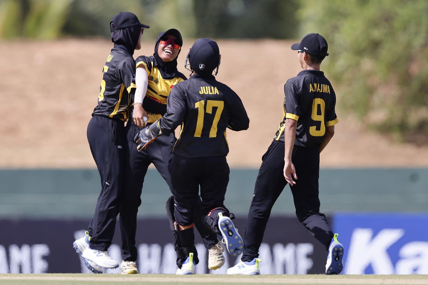 The Malaysia team celebrate a Thailand wicket