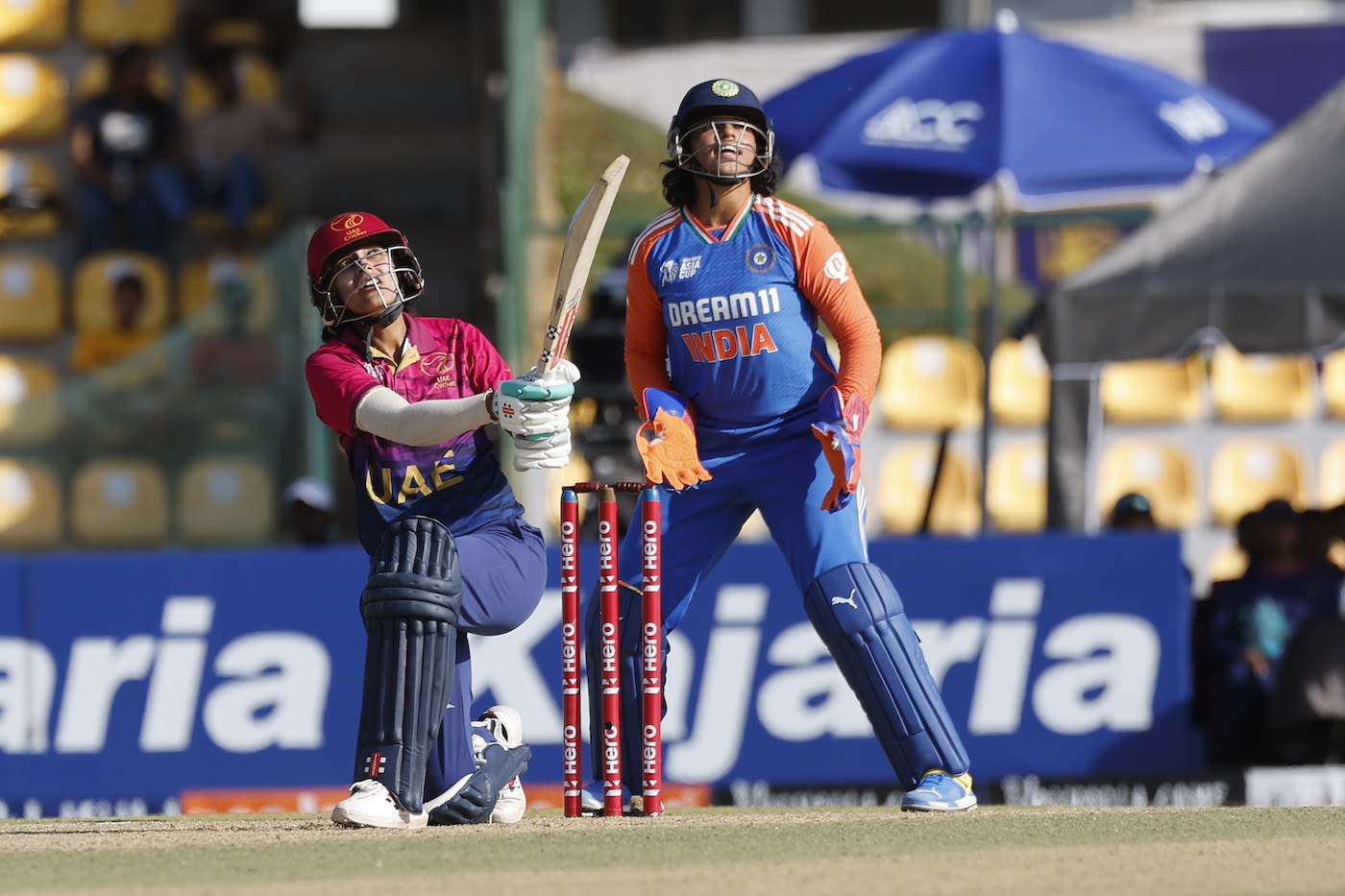 Esha Oza slams the ball over the leg side