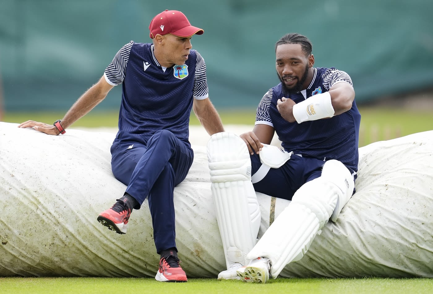 West Indies assistant coach Jimmy Adams chats to opener Mikyle Louis
