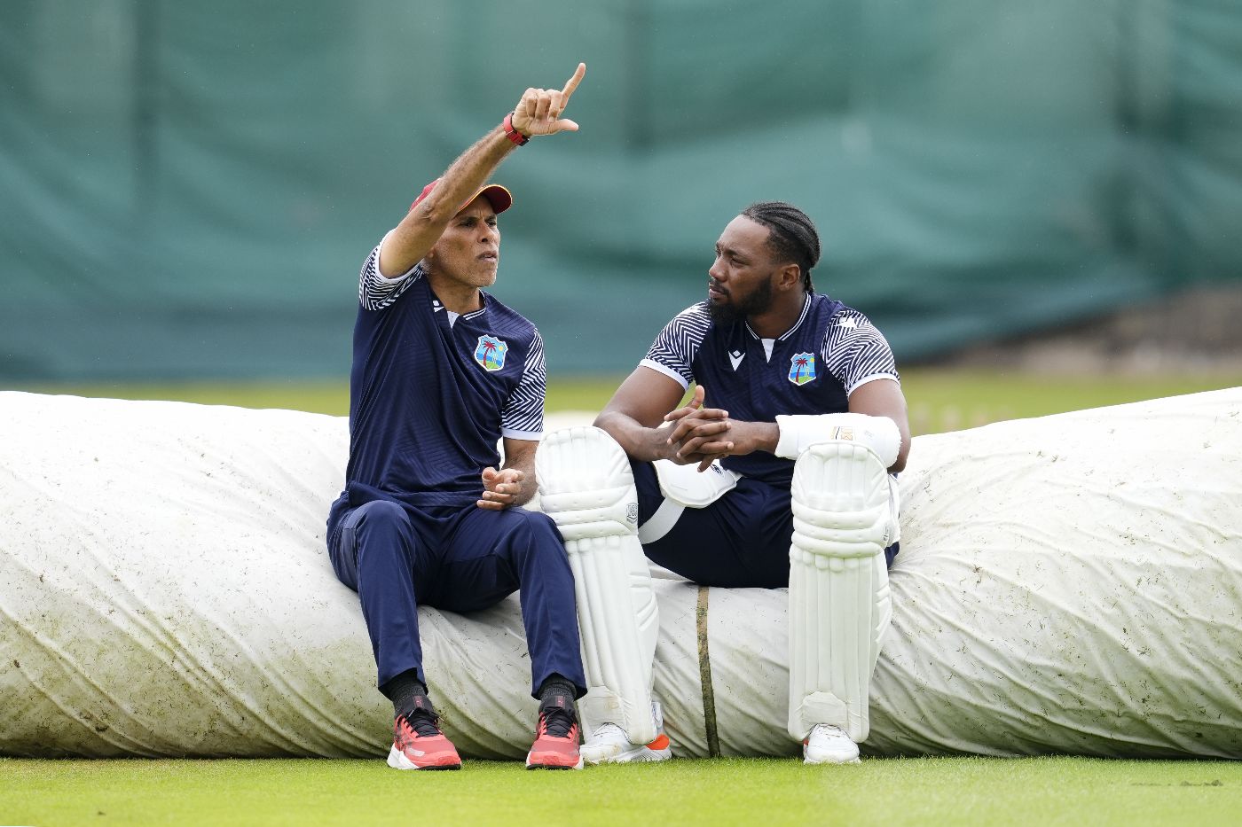 Jimmy Adams and Mikyle Louis chat during West Indies' practice session