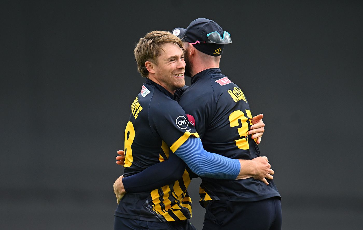 Dan Douthwaite gets a hug from Jamie McIlroy