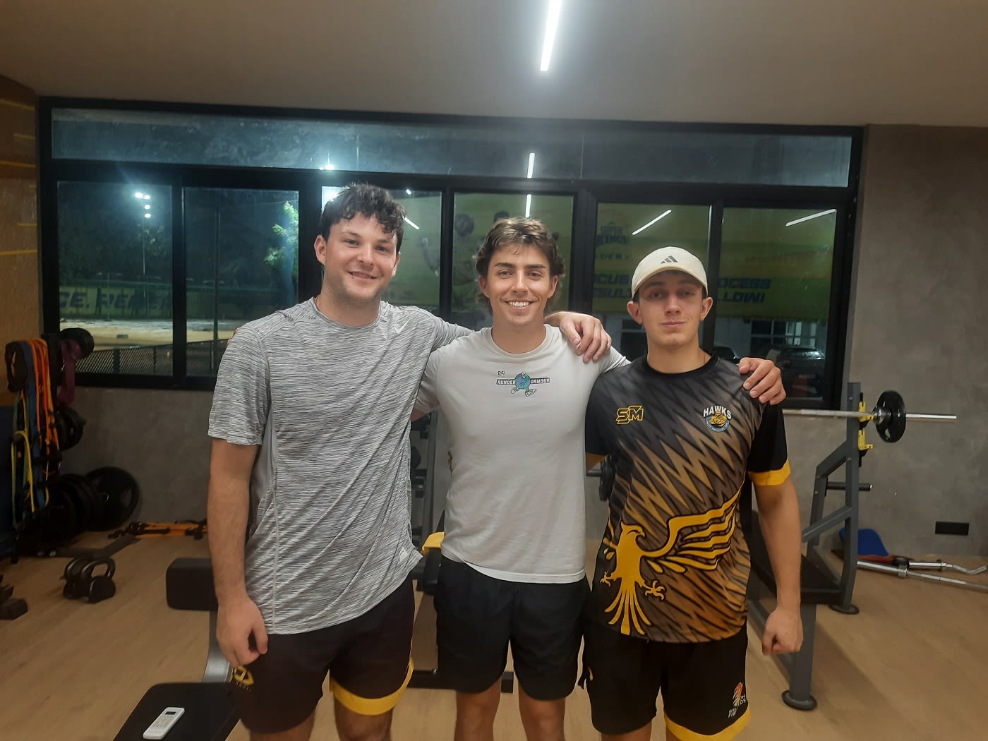Jesse Tashkoff (left-most), Nick Greenwood (centre) and Will Greenwood (right-most) strike a pose