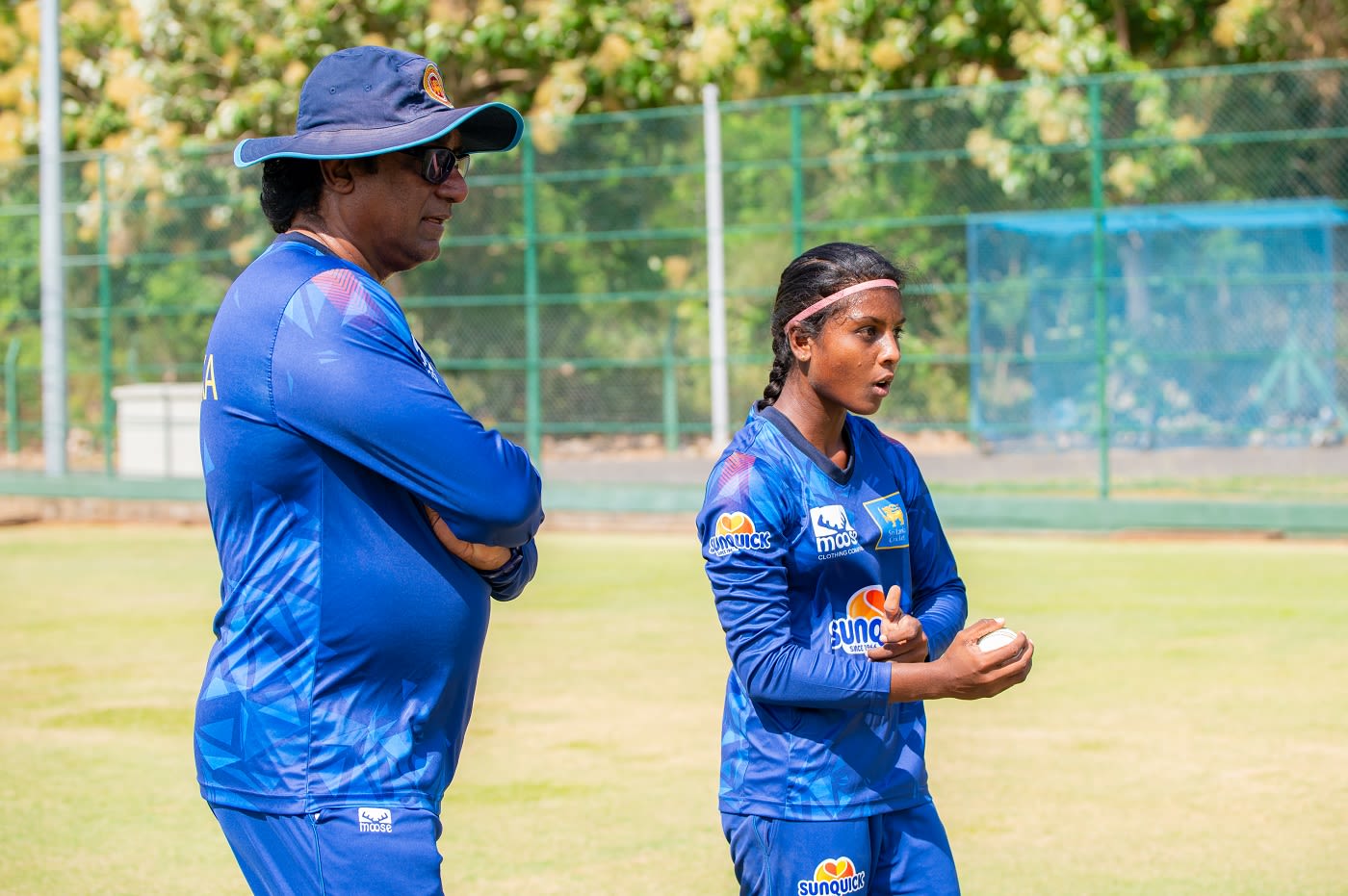 Head coach Rumesh Ratnayake keeps an eye as Sachini Nisansala runs in