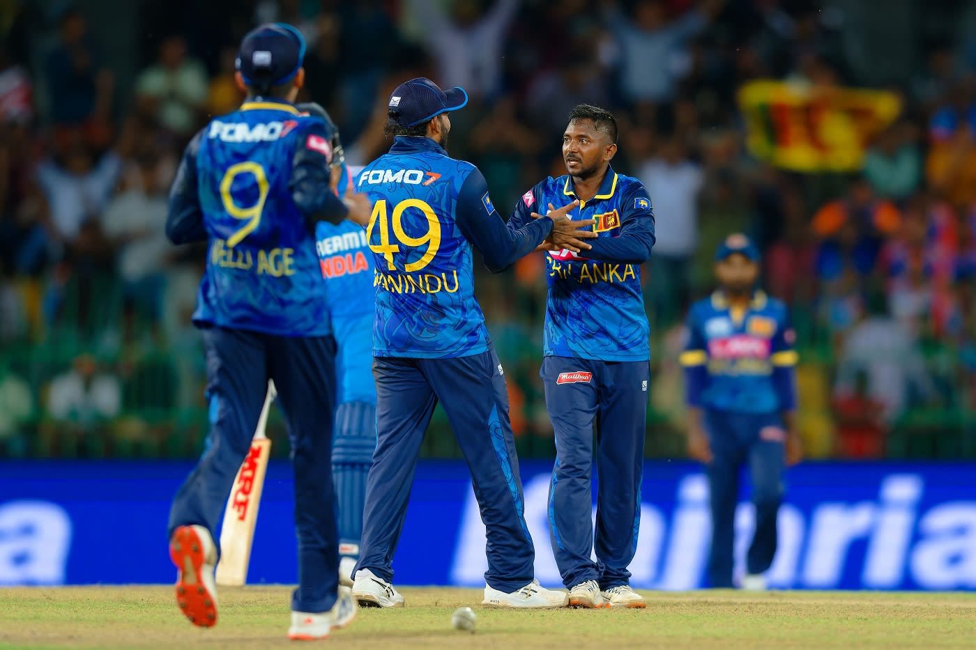 Akila Dananjaya celebrates a dismissal with Wanindu Hasaranga