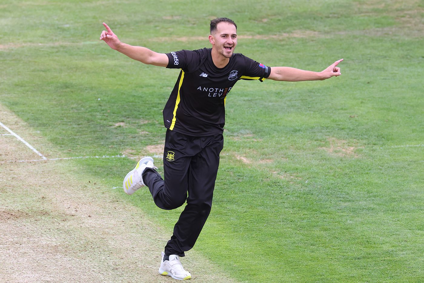 Zaman Akhter wheels away in celebration