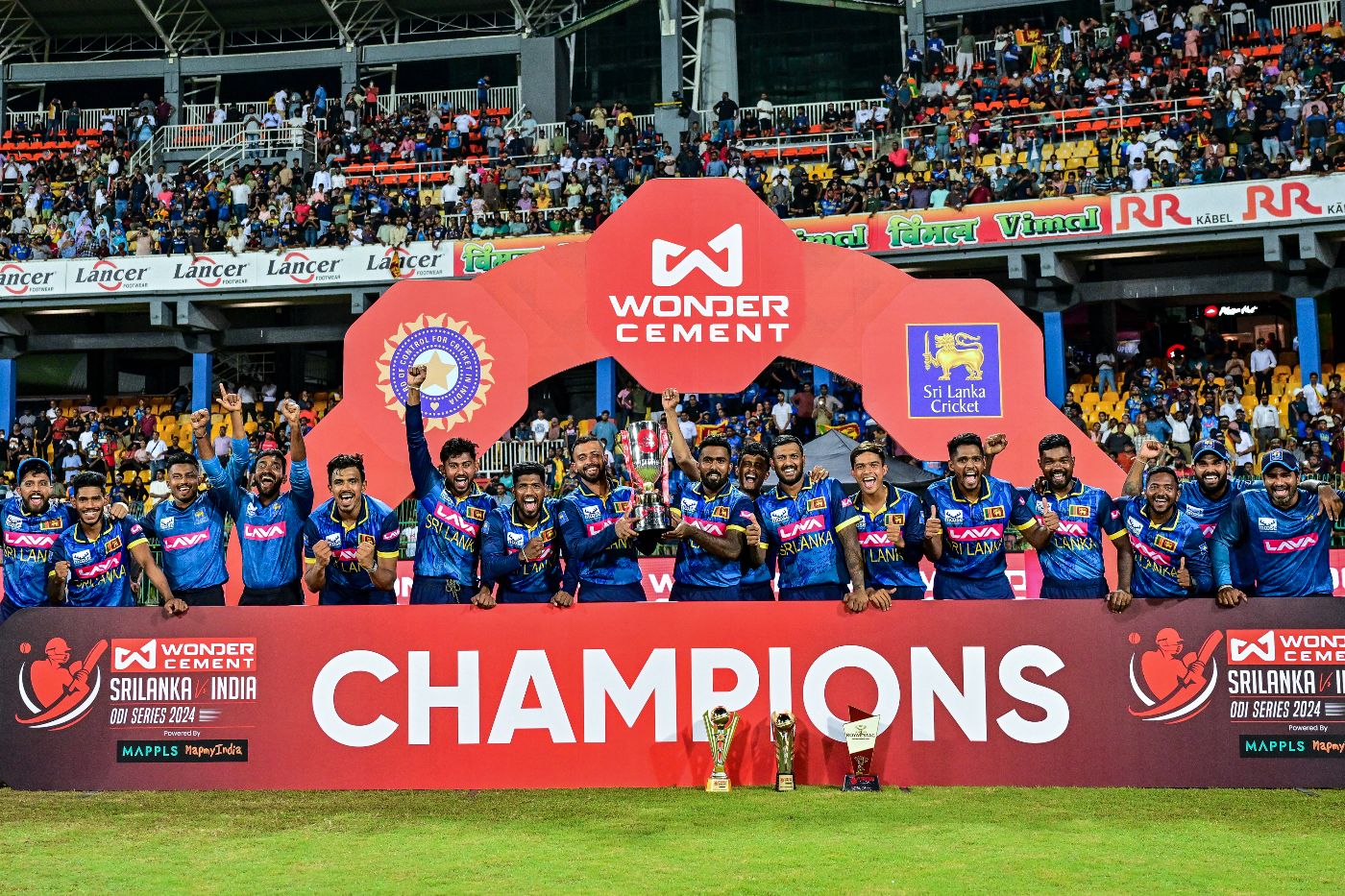 The Sri Lankan team with its spoils after a first bilateral ODI series win against India in 27 years
