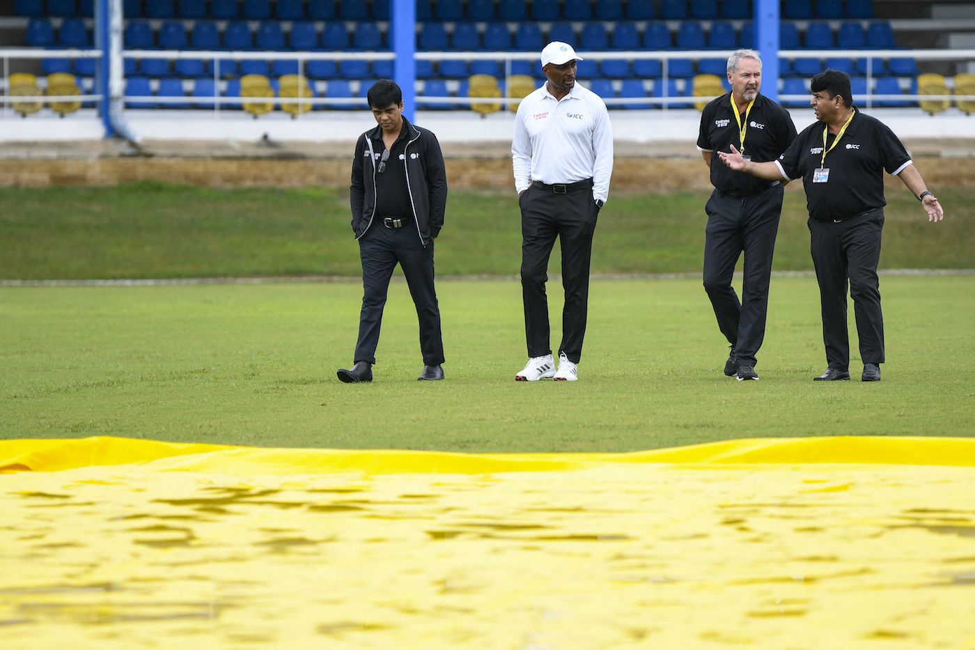 Match officials - Sharfuddoula, Gregory Brathwaite, Richard Illingworth, and Ahsan Raza - busy themselves in an inspection