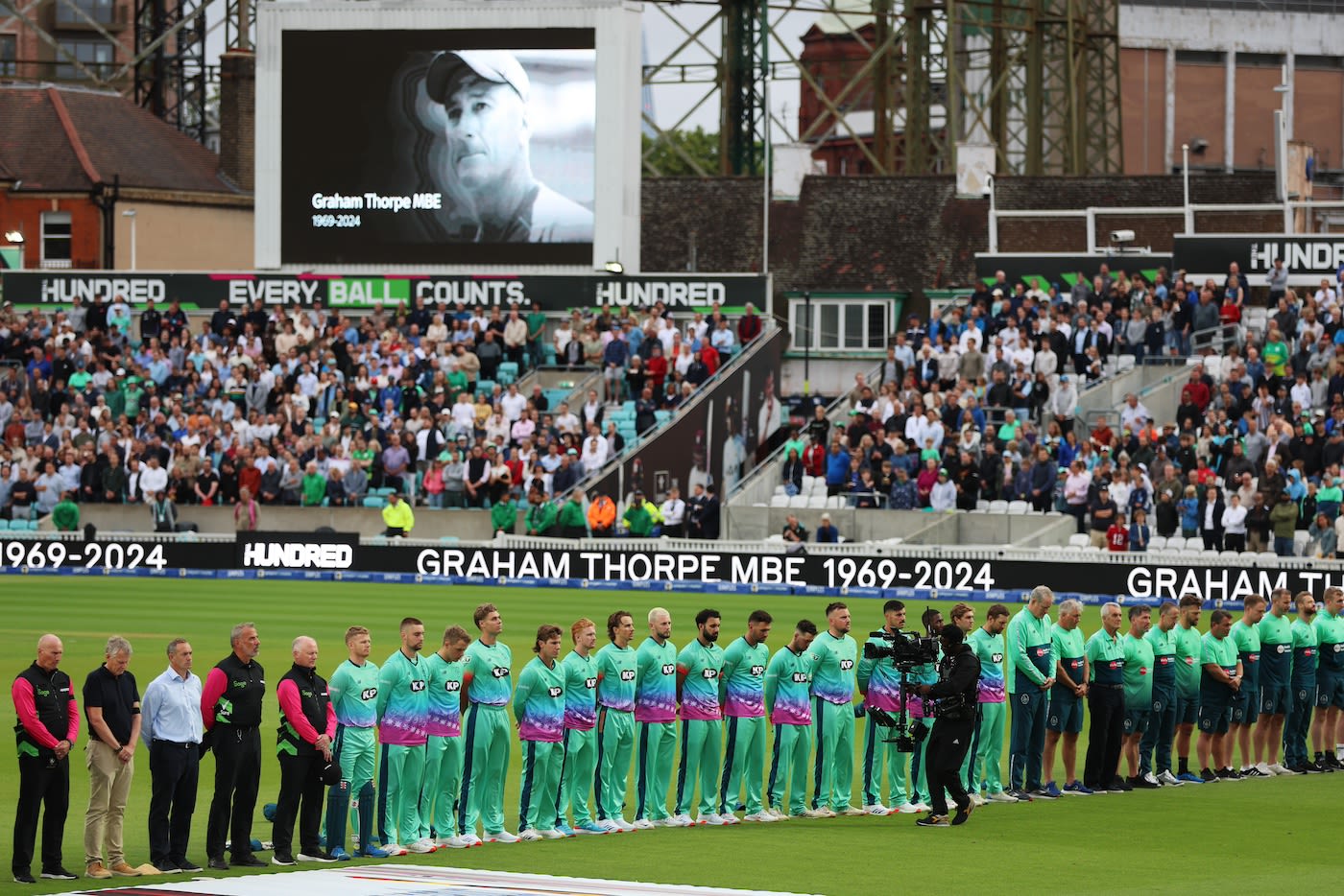 Oval Invincibles players and staff observe a minute's silence for Graham Thorpe