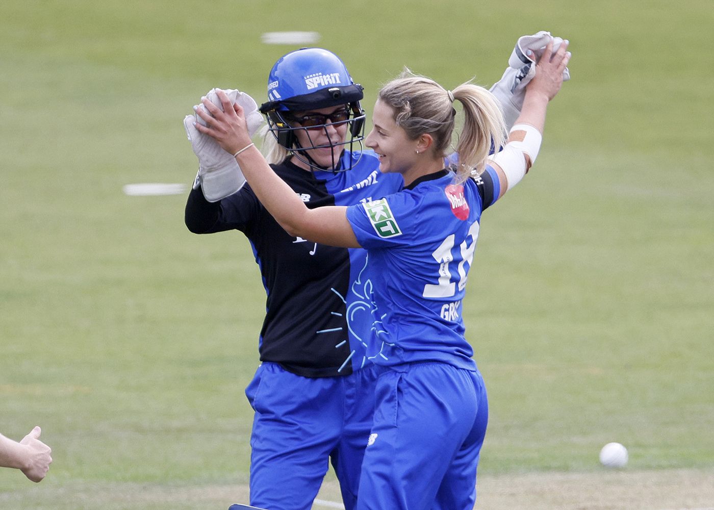 Eva Gray celebrates with Georgia Redmayne after bowling Hollie Armitage