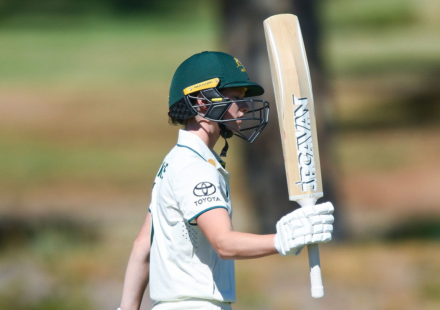 Maddy Darke raises her bat