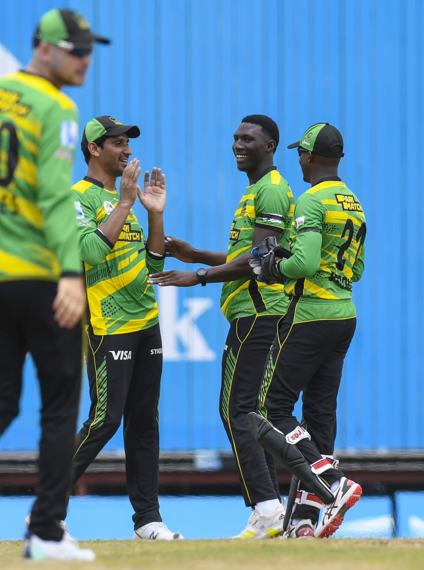 Kelvin Pitman celebrates a wicket with his team-mates