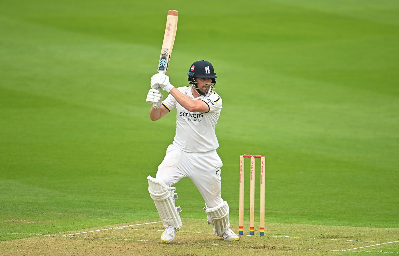 Will Rhodes punches into the off side