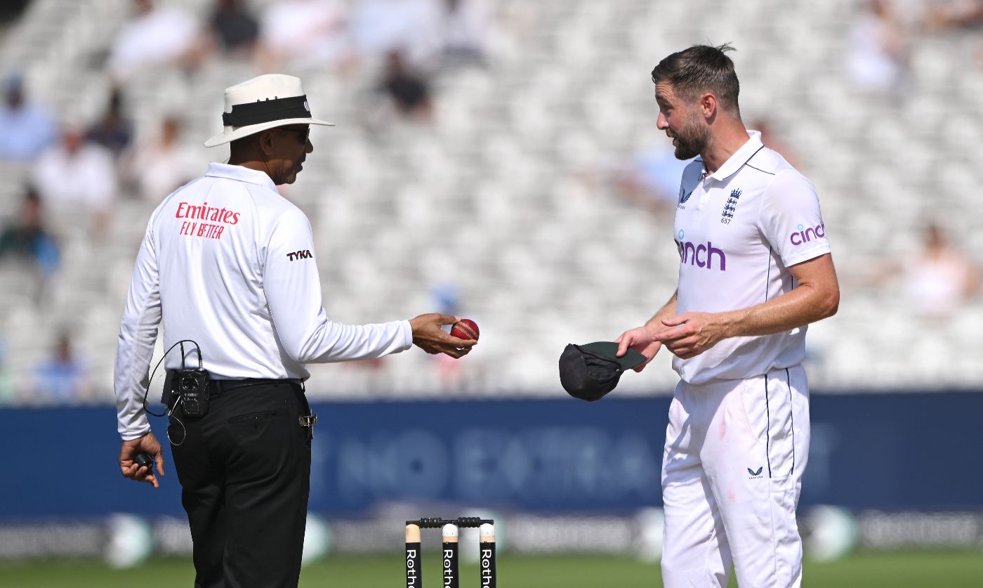 Chris Woakes queries DRS with Joel Wilson after an over-turned lbw appeal