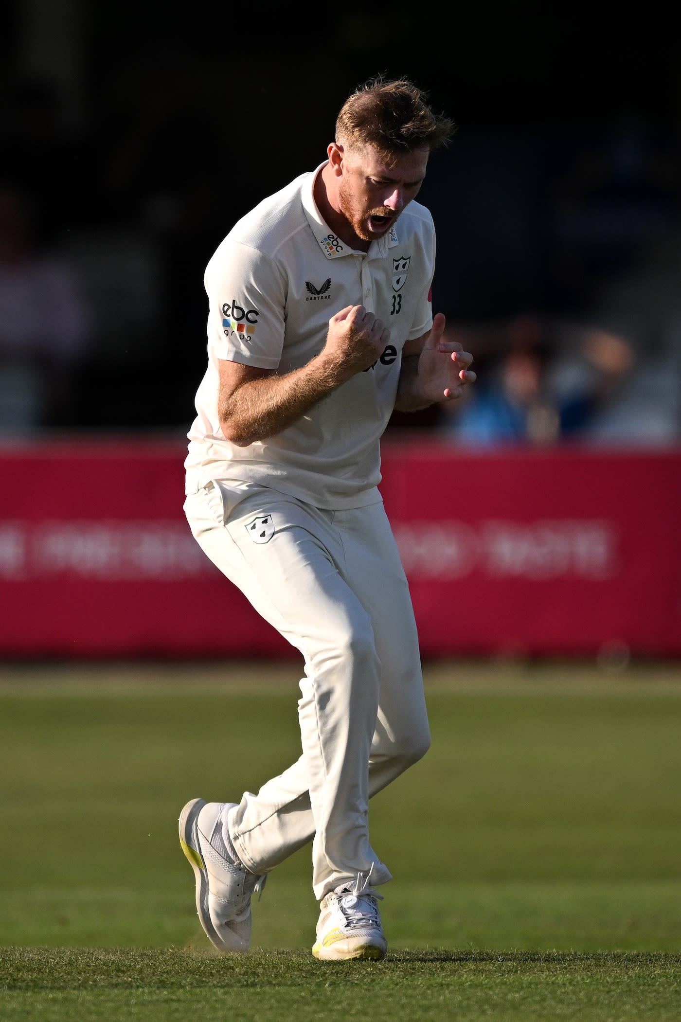 Tom Taylor celebrates the wicket of Dean Elgar