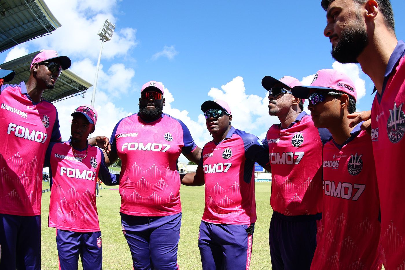Rovman Powell addresses Jason Holder, Alick Athanaze, Maheesh Theekshana, and Naveen-ul-Haq in a huddle