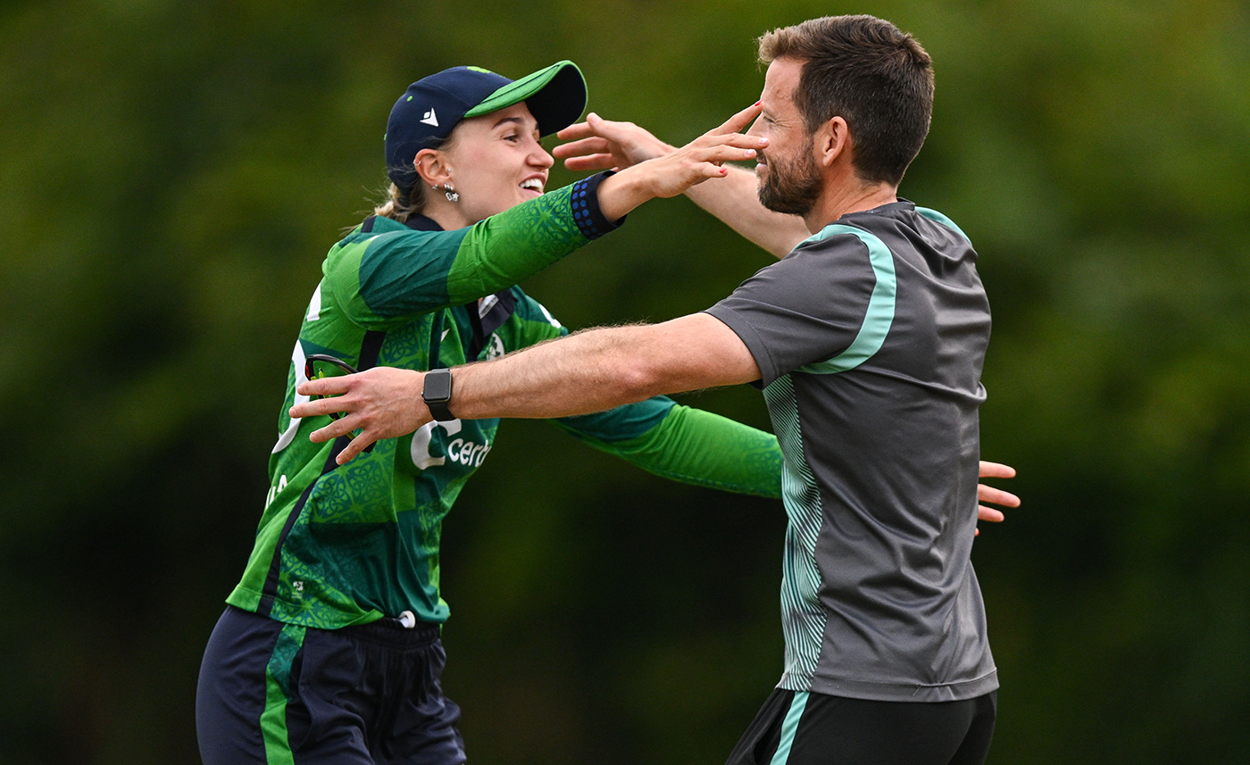 Gaby Lewis and Ireland head coach Ed Joyce embrace