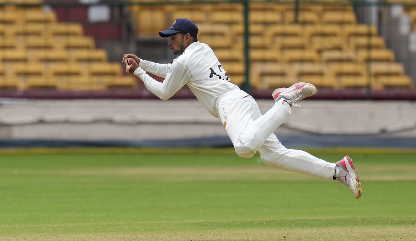 Musheer Khan is airborne as he completes a catch
