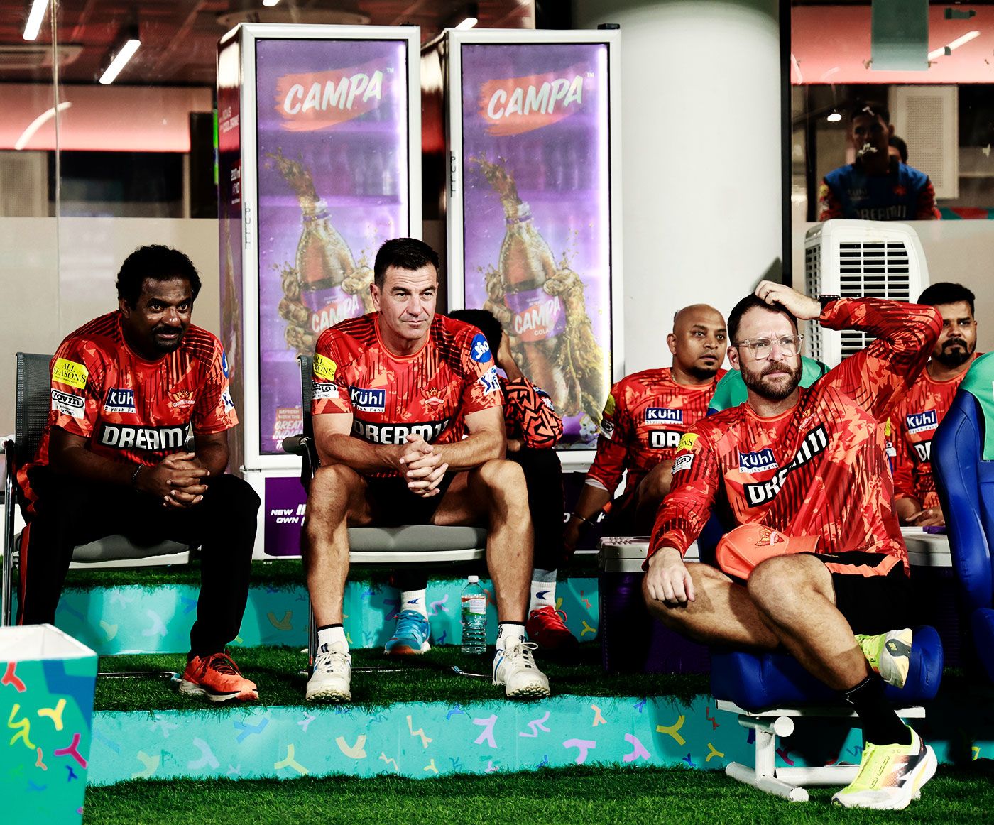 Muthiah Muralidaran, Simon Helmot and Daniel Vettori watch the final