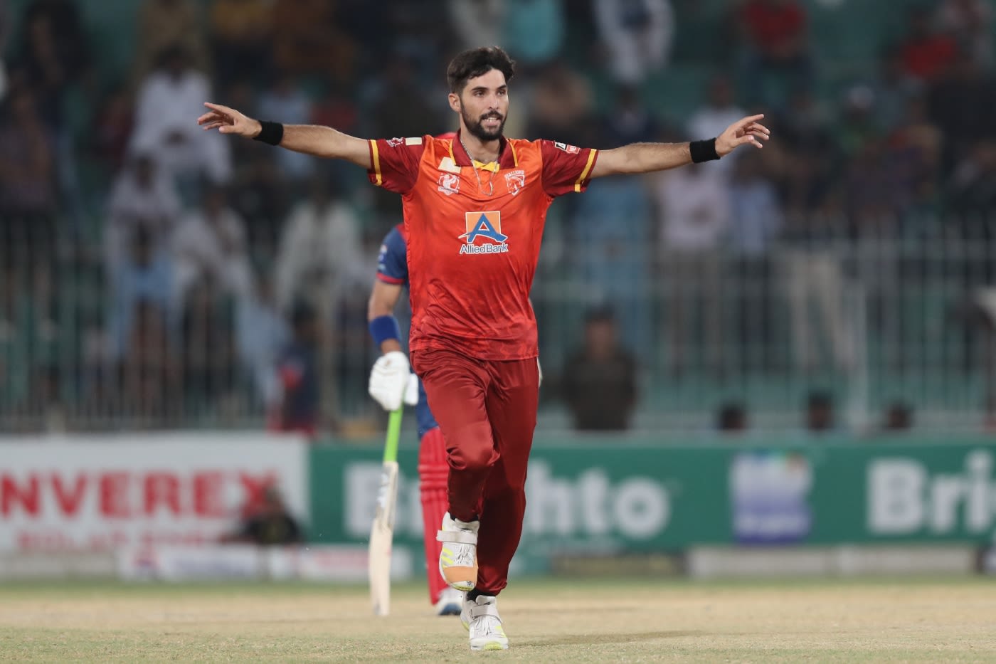 Jahandad Khan celebrates a wicket