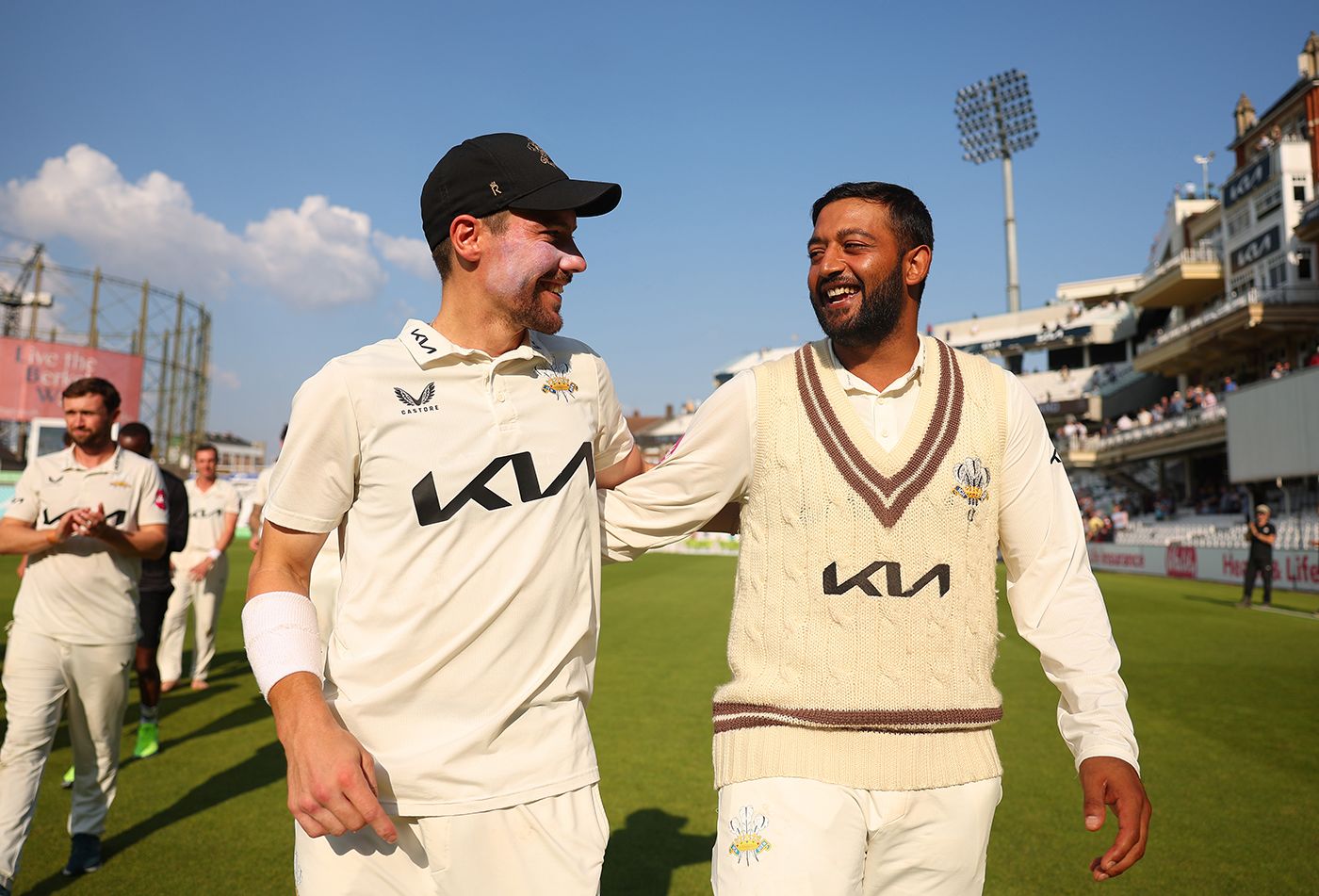 Rory Burns and Ryan Patel celebrate together