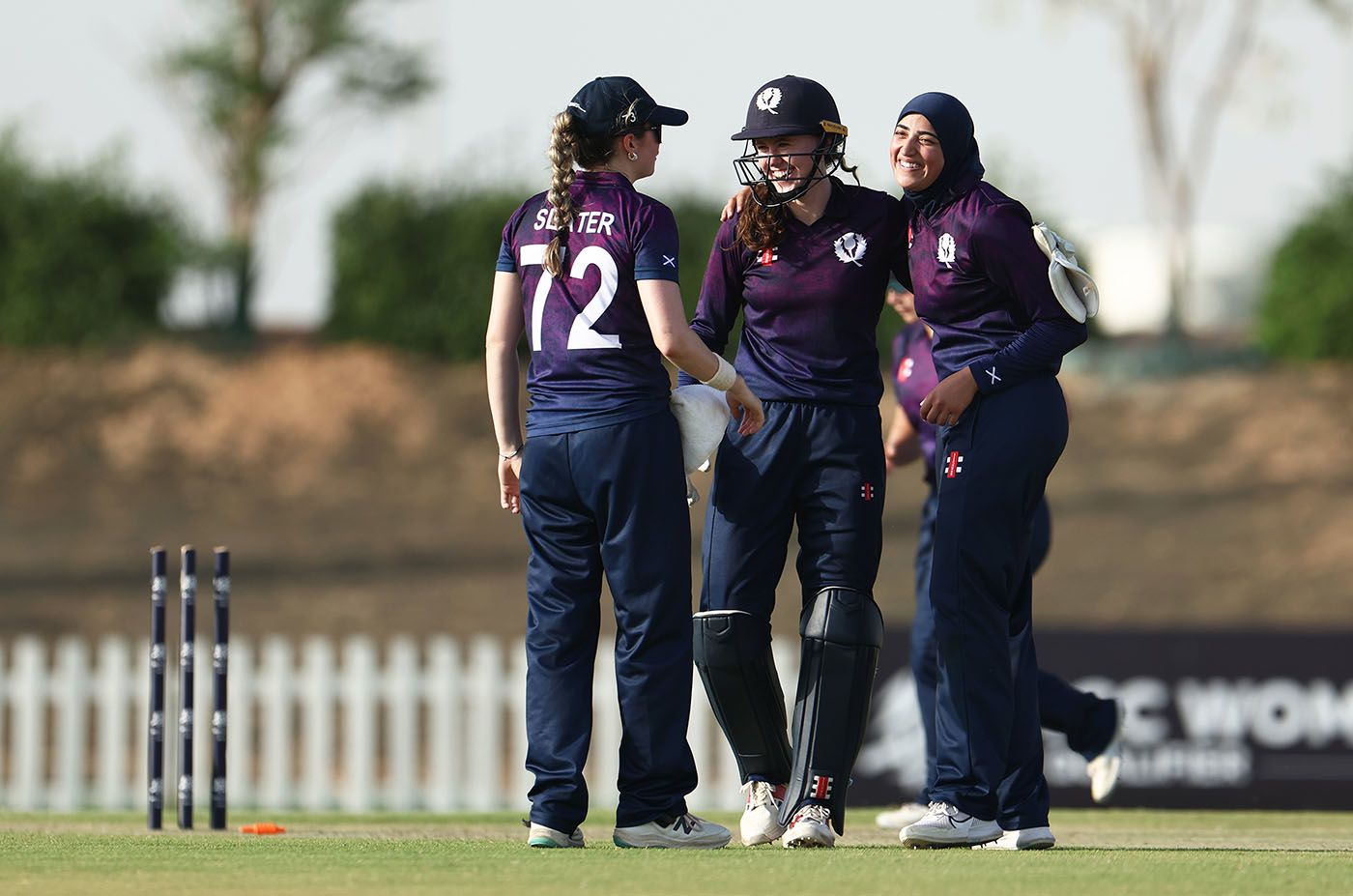 Sarah Bryce and Abtaha Maqsood celebrate the wicket of Jessica Willathgamuwa
