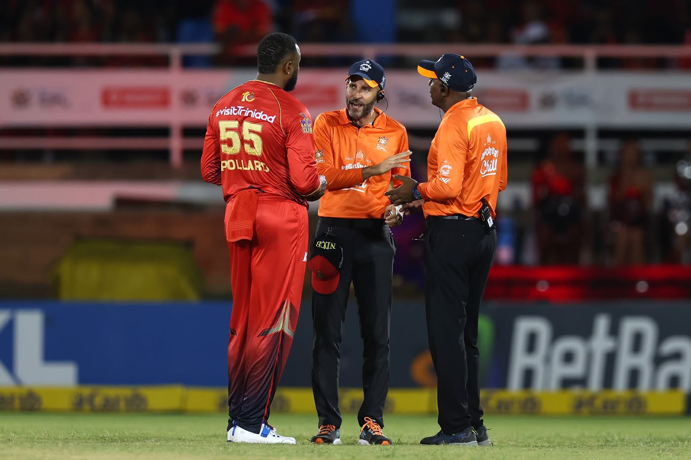 Kieron Pollard has a word with umpires Christopher Taylor and Patrick Gustard after confusion regarding Imad Wasim's potential dismissal