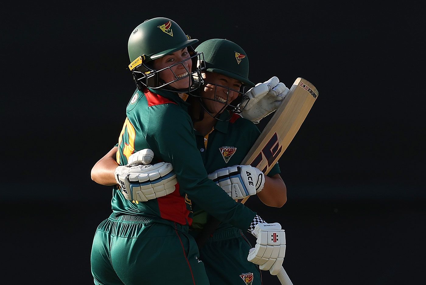 Maisy Gibson and Callie Wilson celebrate Tasmania's one-wicket win