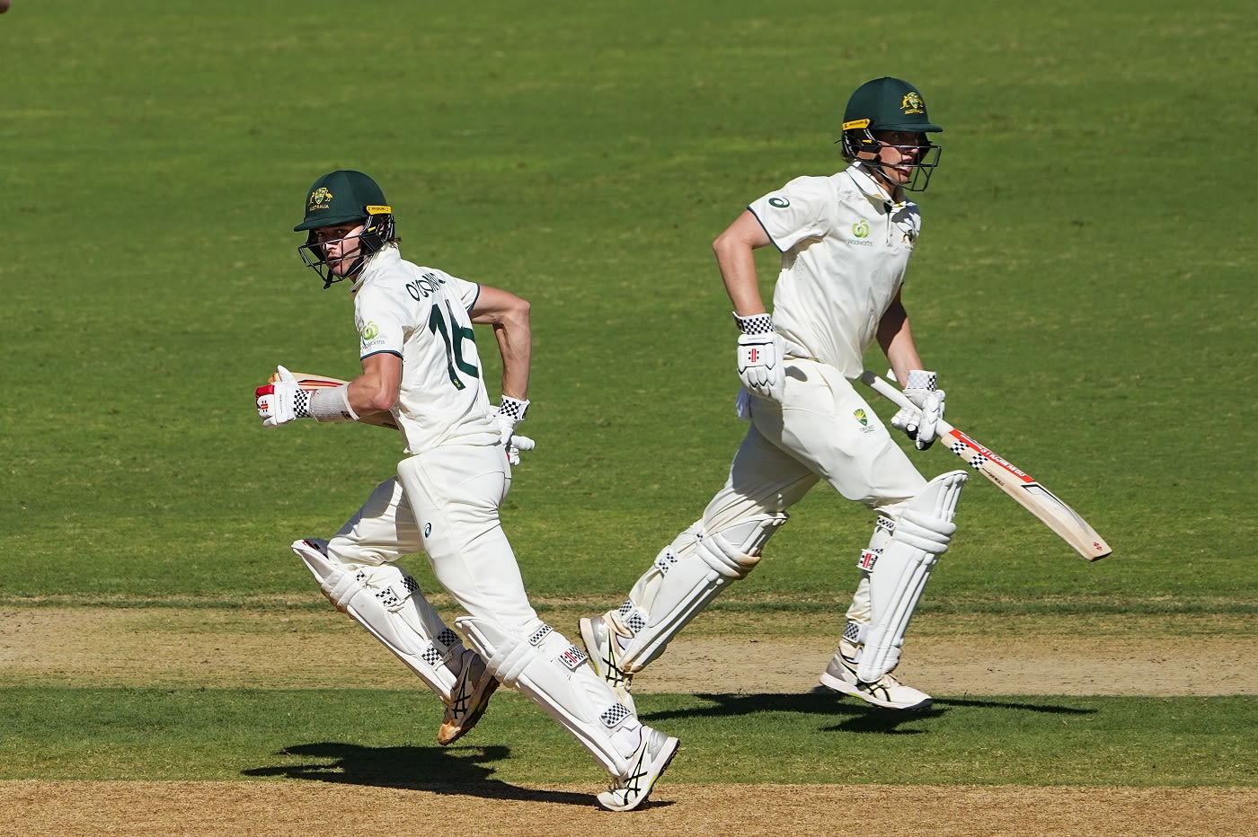 Aidan O'Connor and Christian Howe run between the wickets