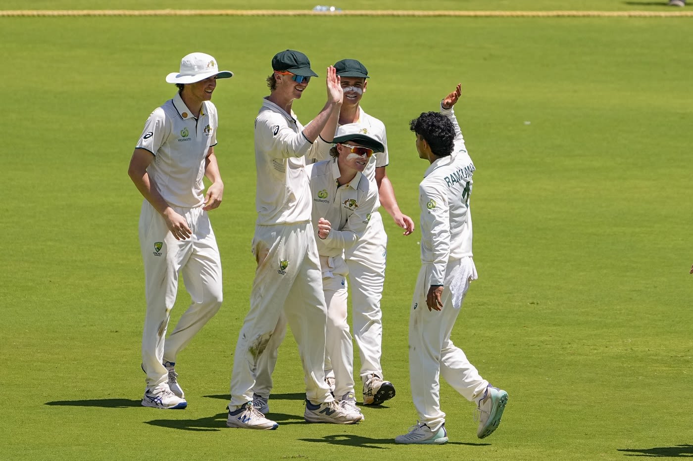 Vishwa Ramkumar celebrates a wicket with his team-mates
