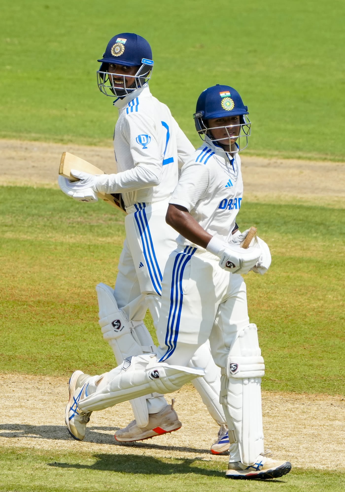 Nitya Pandya and KP Karthikeya run between the wickets