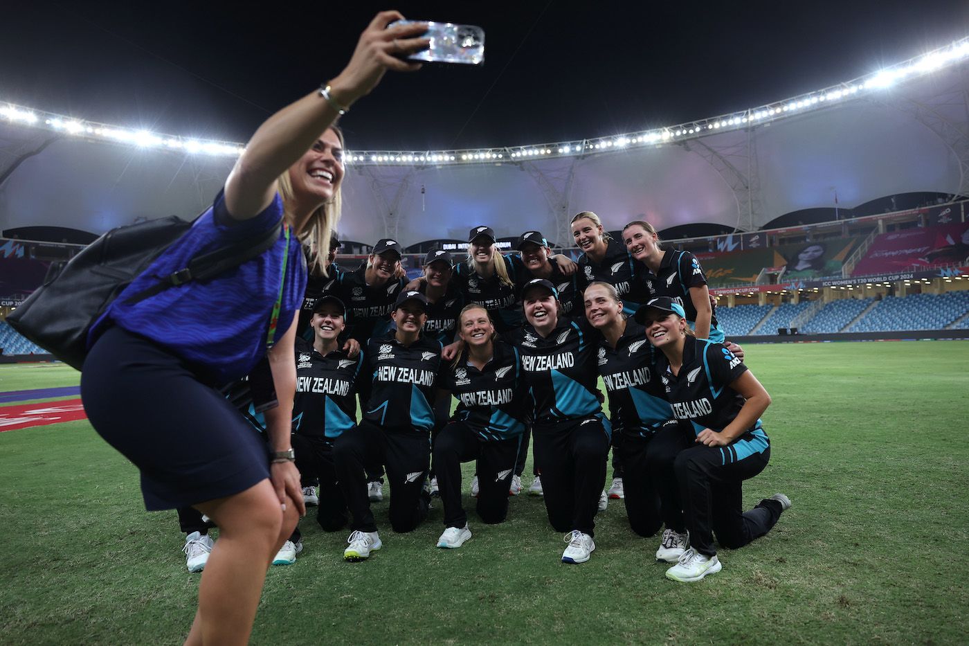 Broadcaster Laura McGoldrick takes a selfie with the New Zealand team post their semi-finals-sealing win