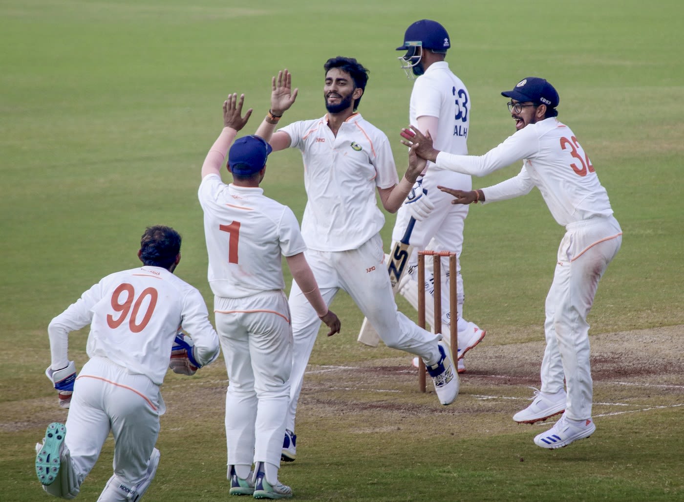 Aditya Thakare celebrates with his team-mates