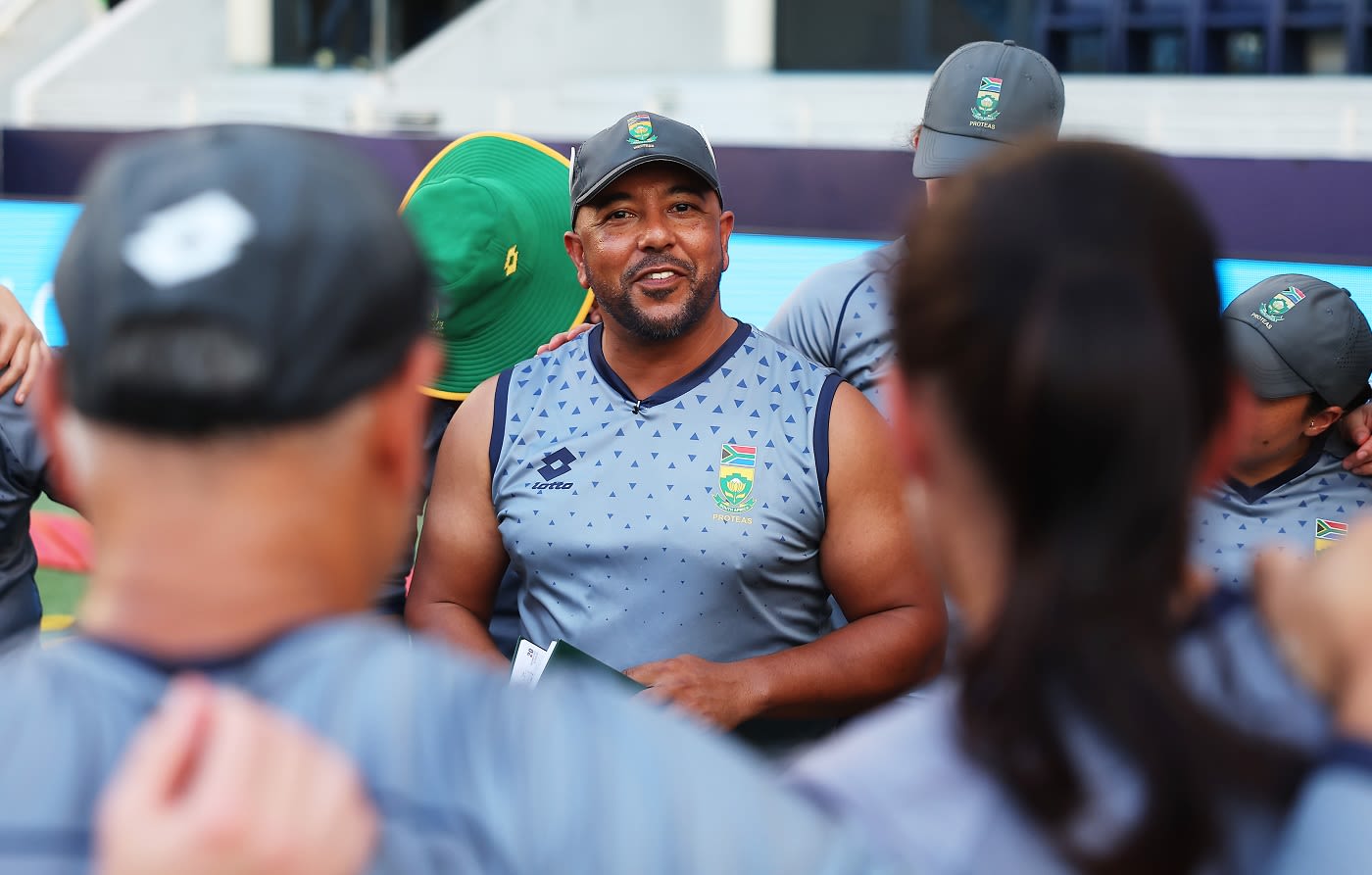 Paul Adams speaks at the team huddle