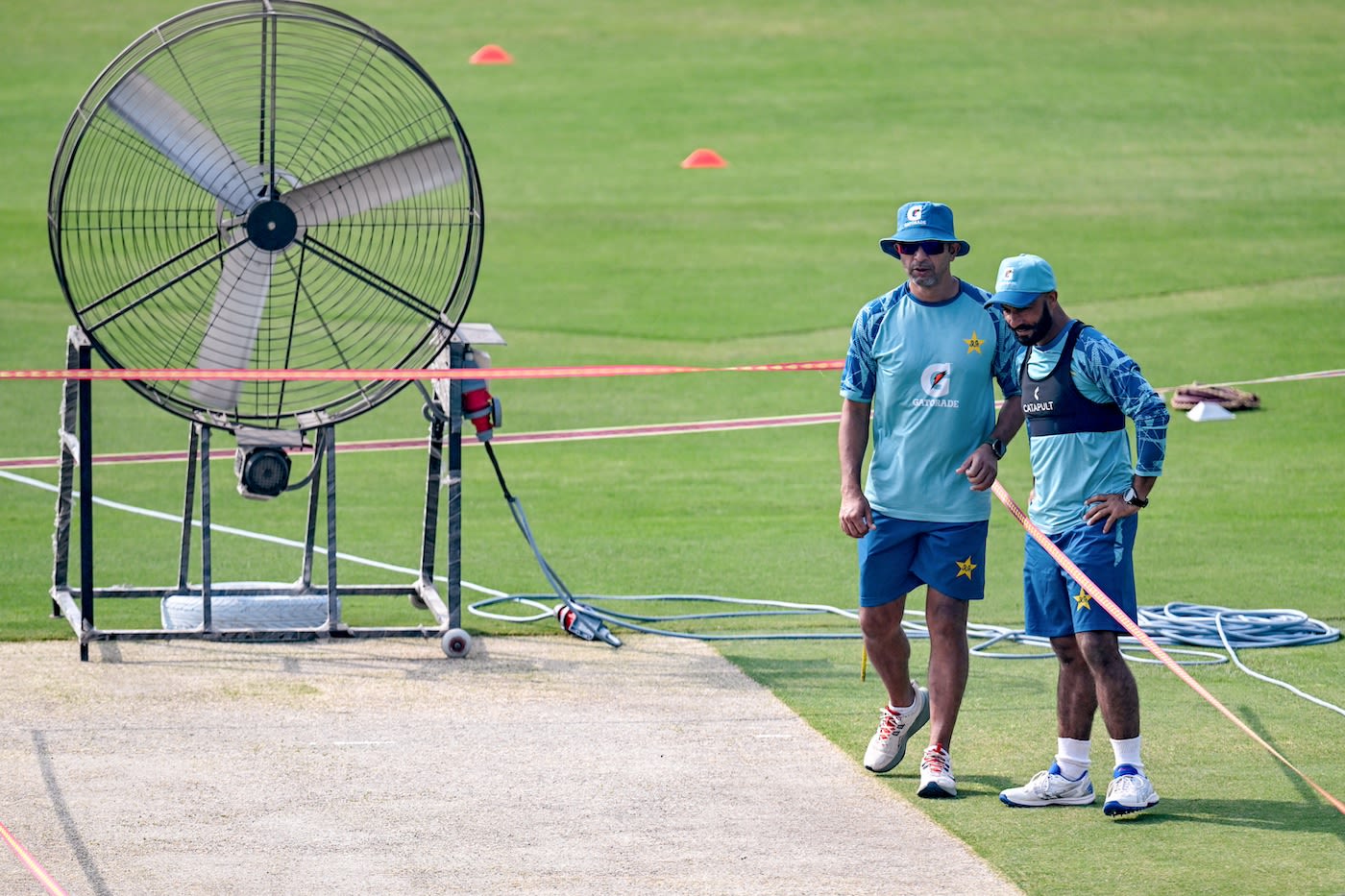 Azhar Mahmood and Sajid Khan take stock as a giant fan does its work on the Rawalpindi pitch