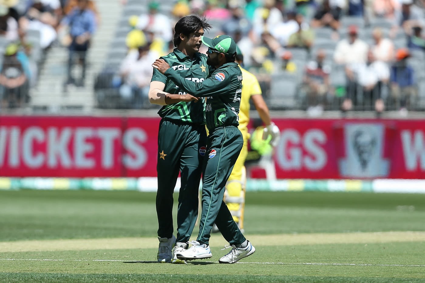 Mohammad Hasnain gets a hug from Babar Azam after he had Marcus Stoinis nicking behind