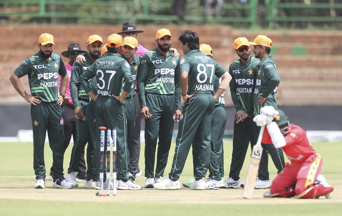 Pakistan players celebrate Joylord Gumbie's run-out