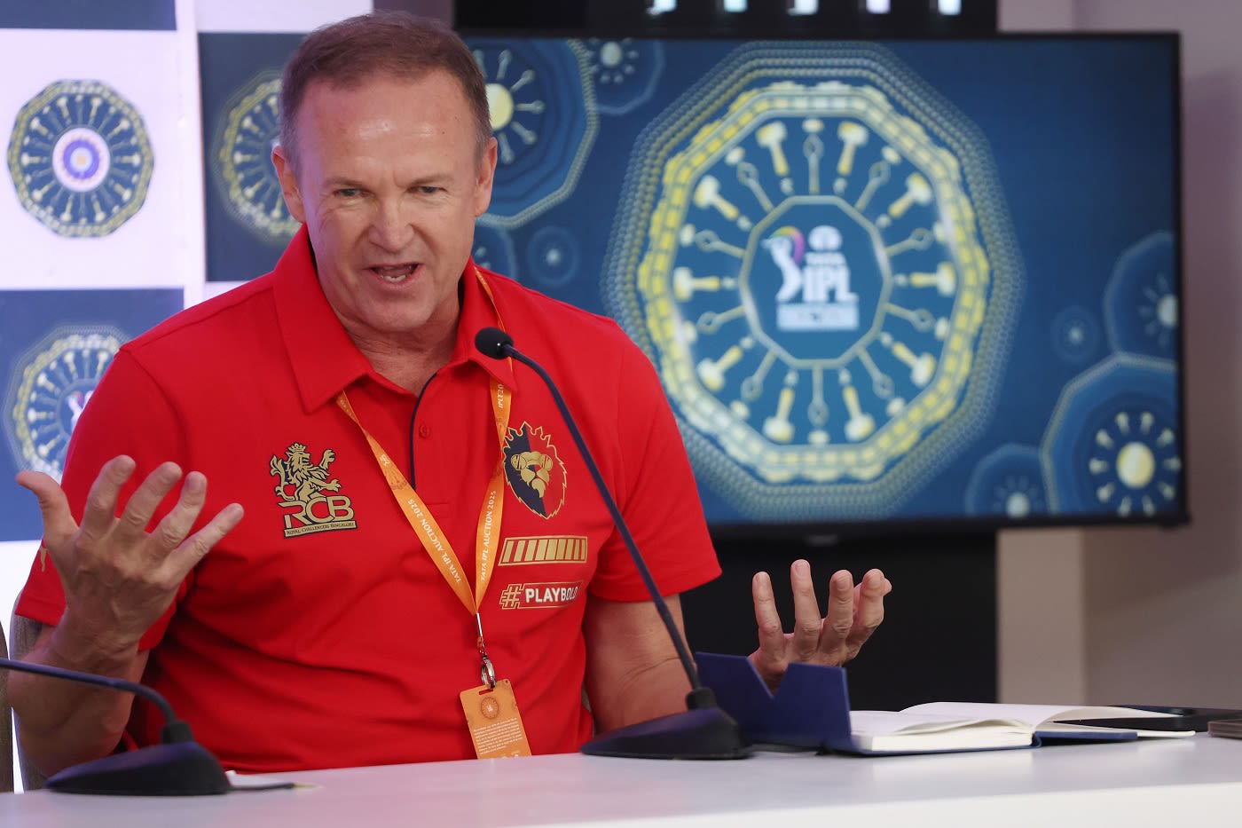 Andy Flower speaks at a press conference during the auction