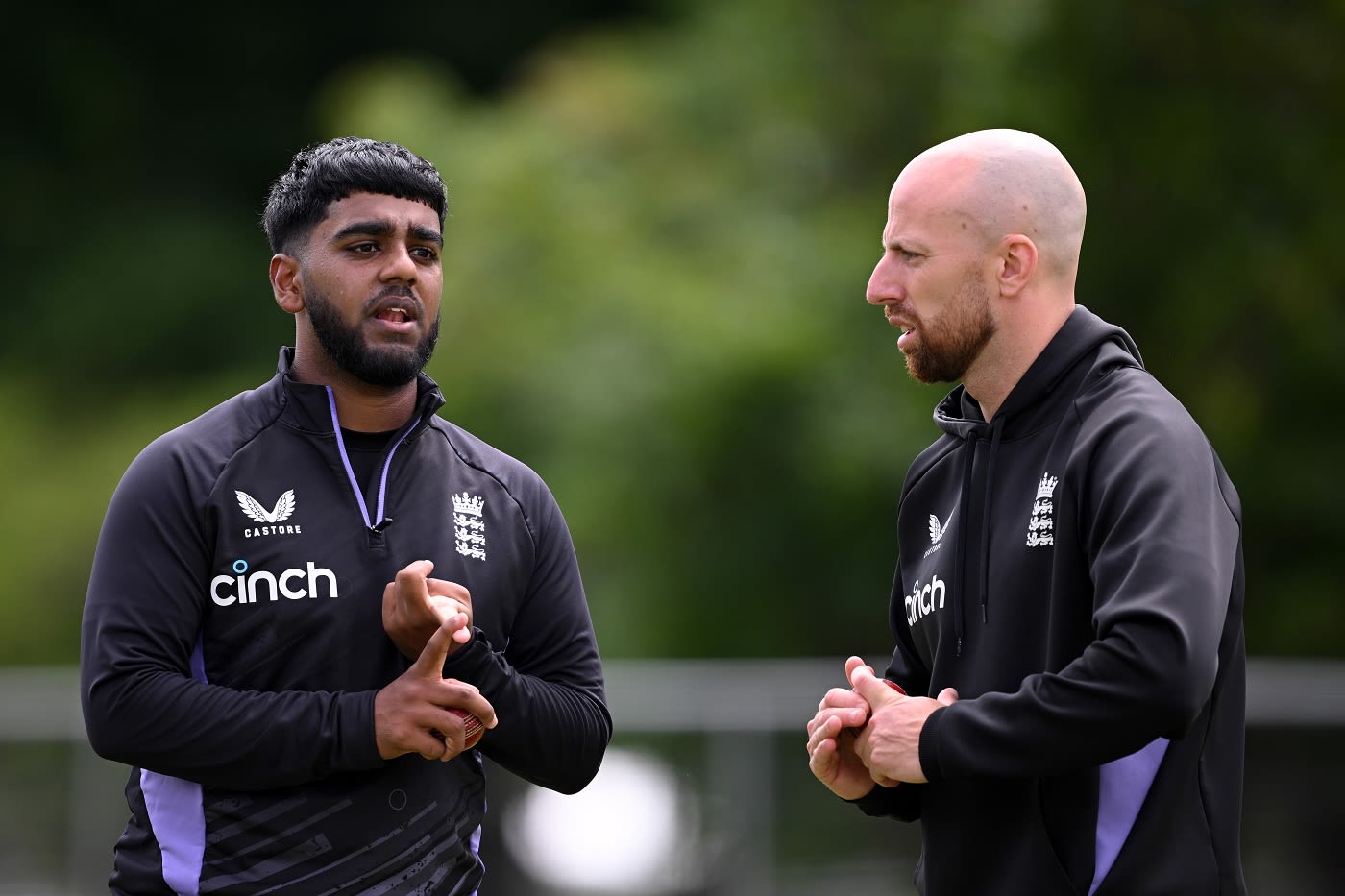 Rehan Ahmed and Jack Leach chat during a training session