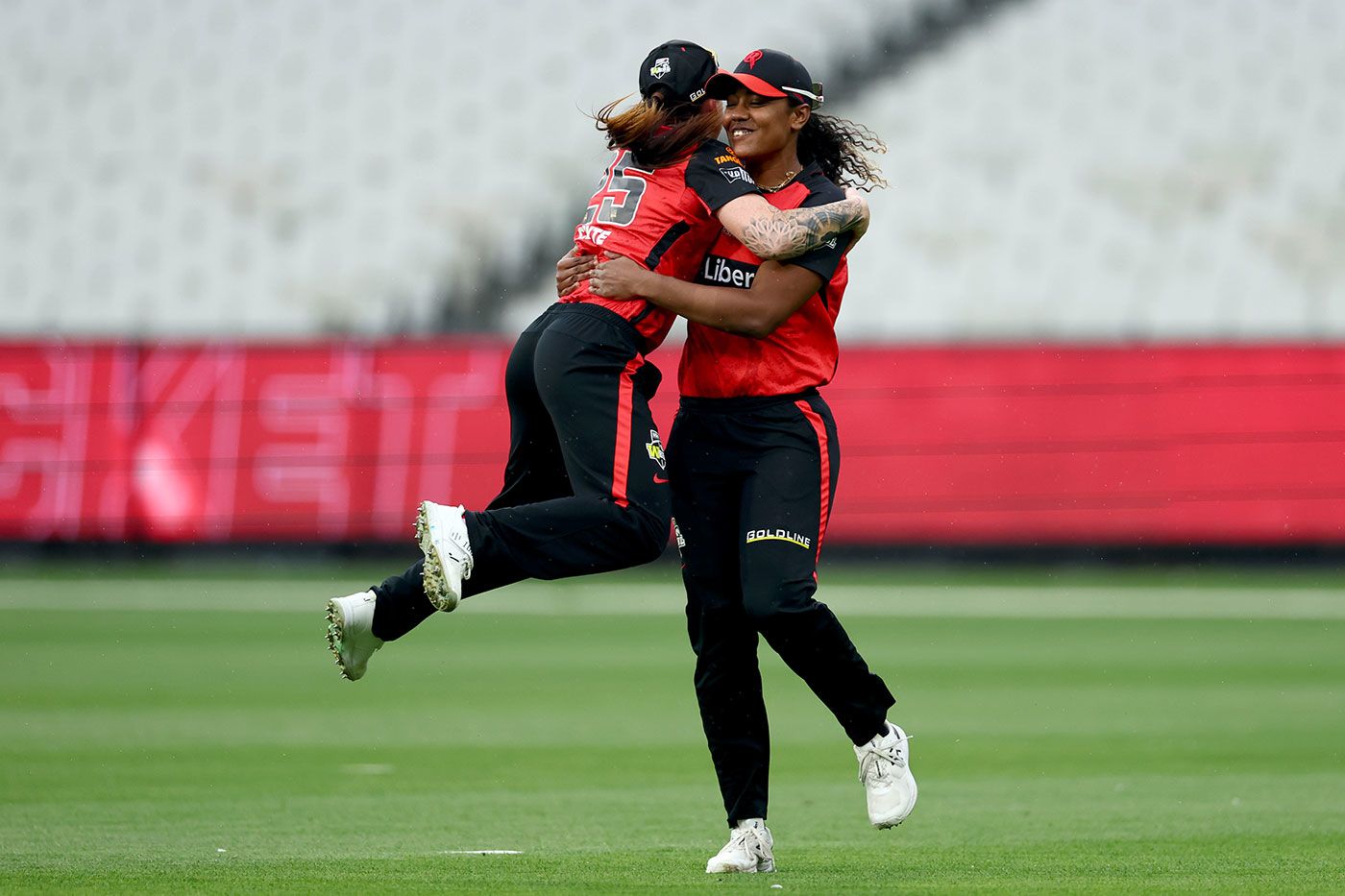 Sarah Coyte celebrates with Hayley Matthews