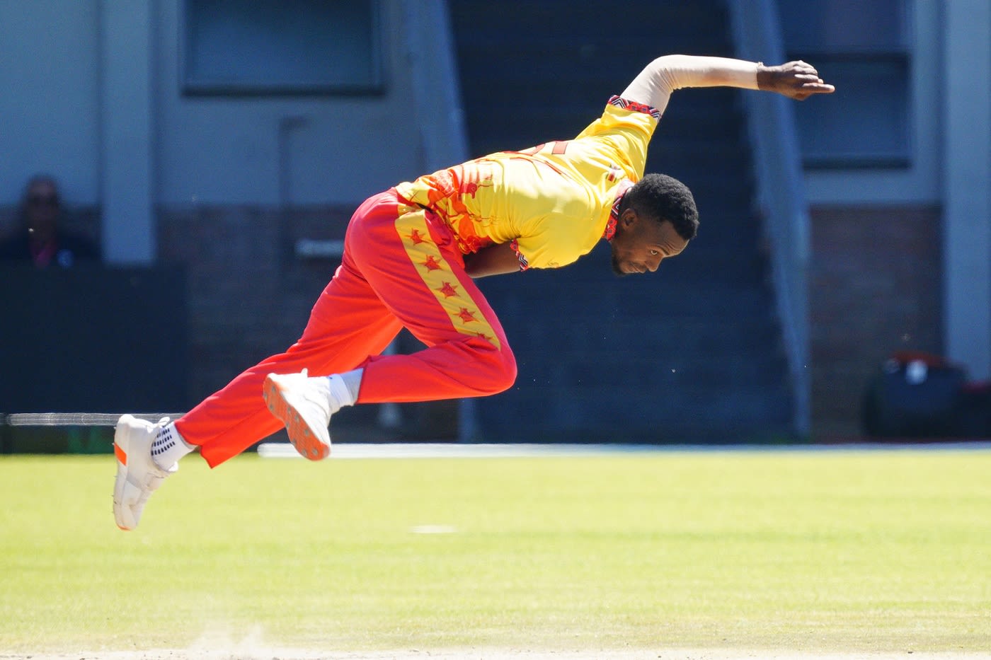 Trevor Gwandu bends his back