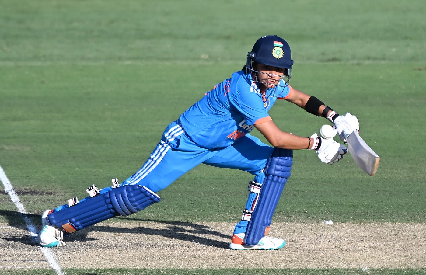 Saima Thakor drives one square through the off side