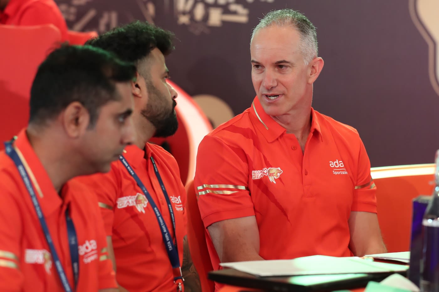 Gujarat Giants head coach Michael Klinger consults his colleagues at the WPL auction table