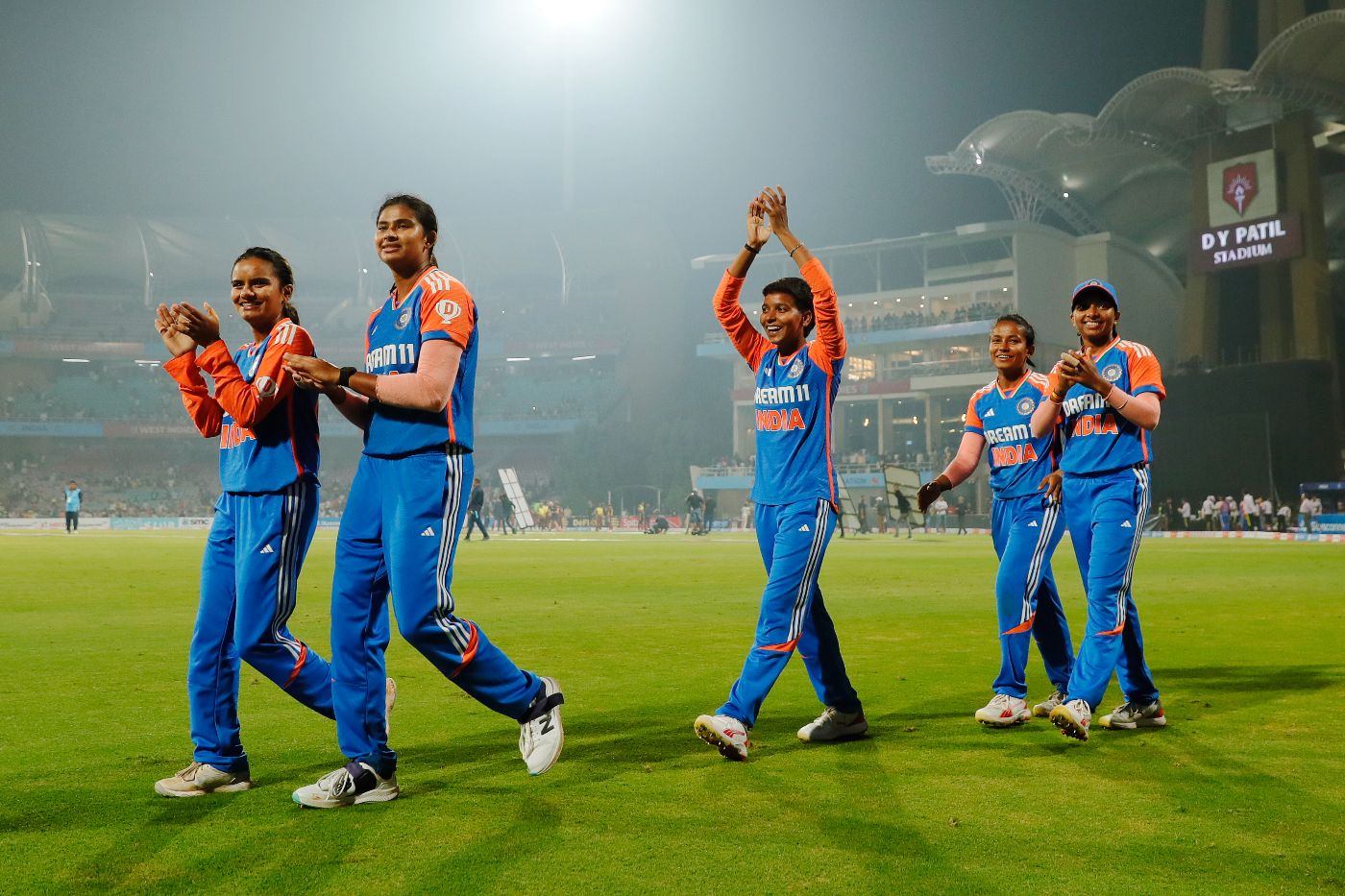 India take a victory lap around the DY Patil Sports Academy in Navi Mumbai after wrapping up the T20I series (In pic: Nandini Kashyap, Titas Sadhu, Priya Mishra, Uma Chetry, Minnu Mani)