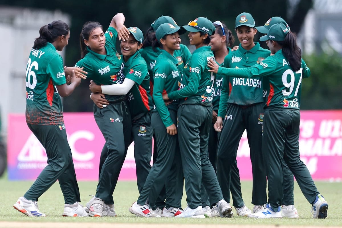 The Bangladesh fielders celebrate the fall of an Indian wicket