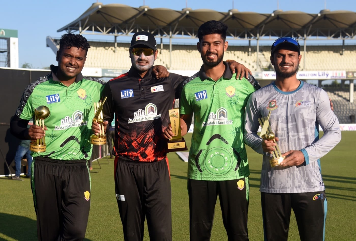 From L to R: Alauddin Babu, Mohammad Naim, Mukidul Islam and Abu Hider with their respective trophies