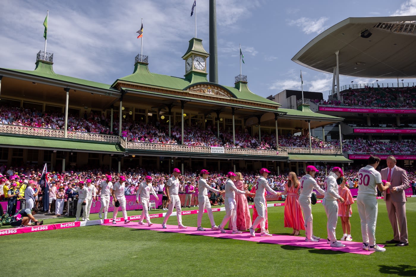 The Australian players meet Glenn McGrath and members of his family during the cap exchange ceremony