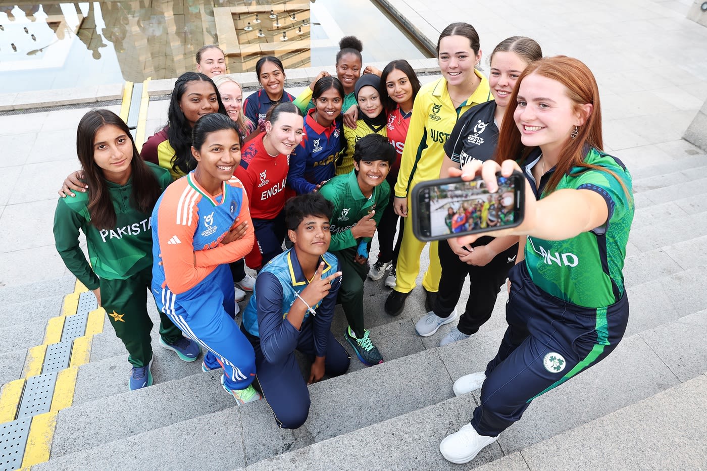 The 16 captains of the upcoming Women's U-19 World Cup share a light moment before the games begin