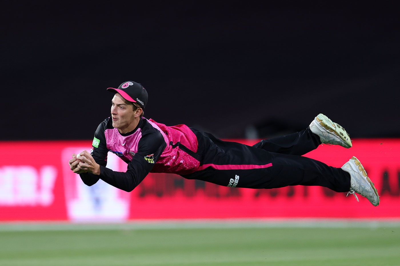 Lachlan Shaw goes airborne to claimed a fantastic outfield catch