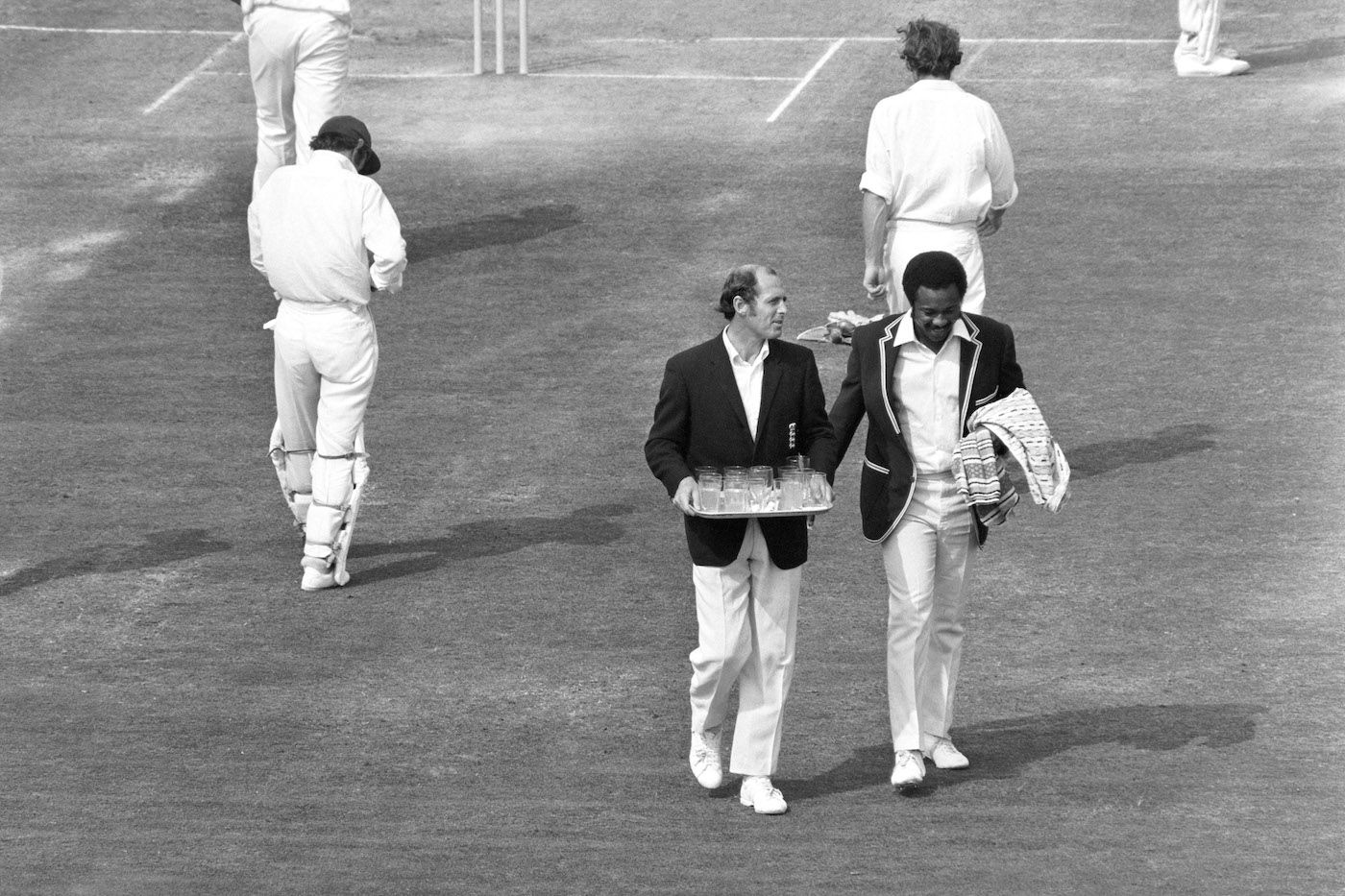 Geoff Boycott and Maurice Foster run drinks